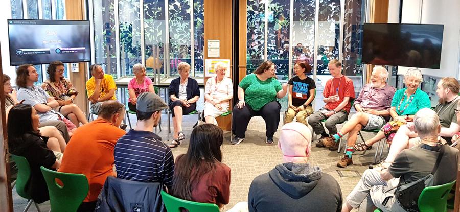 Esperanto speakers sitting in a circle at a recent congress