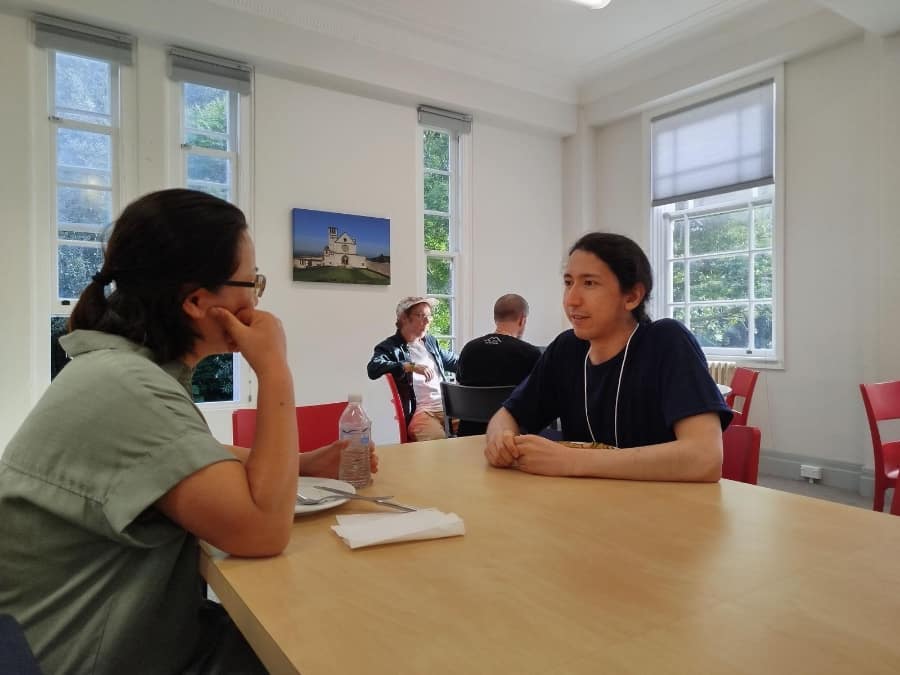 Woman and man talk at table