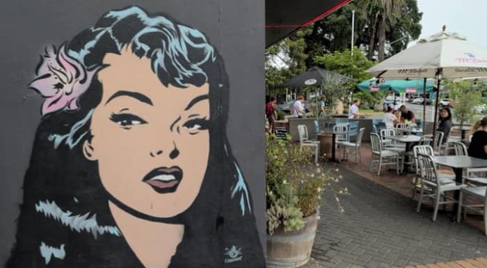 Mural of woman's face next to cafe